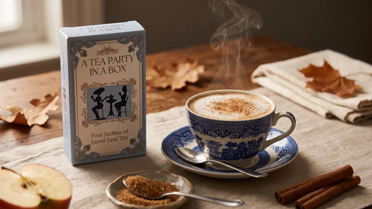 Apple tea recipe: an Apple Pie tea latte with cinnamon foam beside the tea box