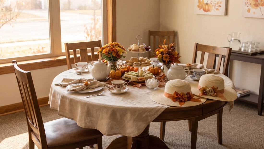 Senior living activity room table set for a tea party with teacups, teapots, and hats