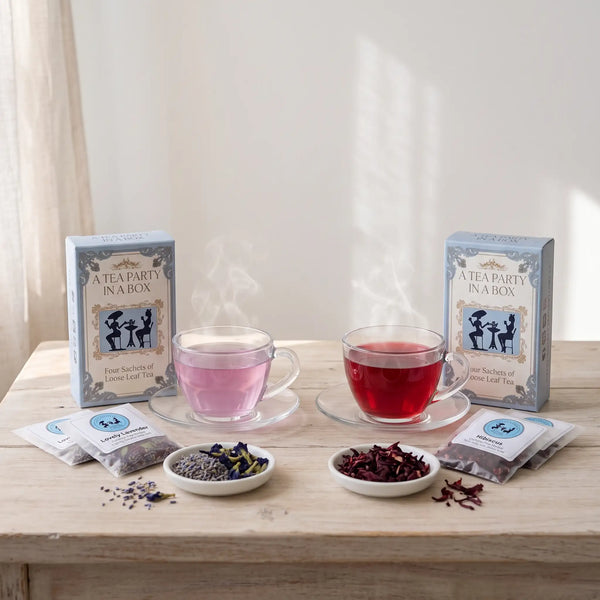 Caffeine-Free herbal teas: Lovely Lavender and Hibiscus brewed in glass cups beside dried lavender and hibiscus flowers