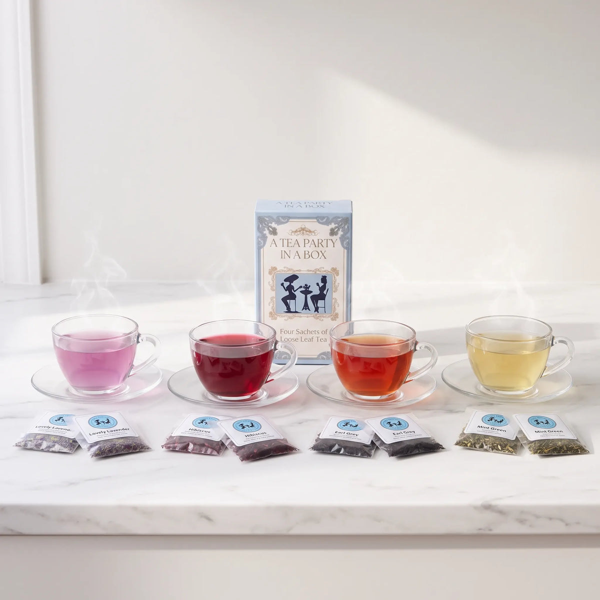 Loose leaf tea sachets: Lovely Lavender, Hibiscus, Earl Grey, and Mint Green brewed in 4 glass cups in a row