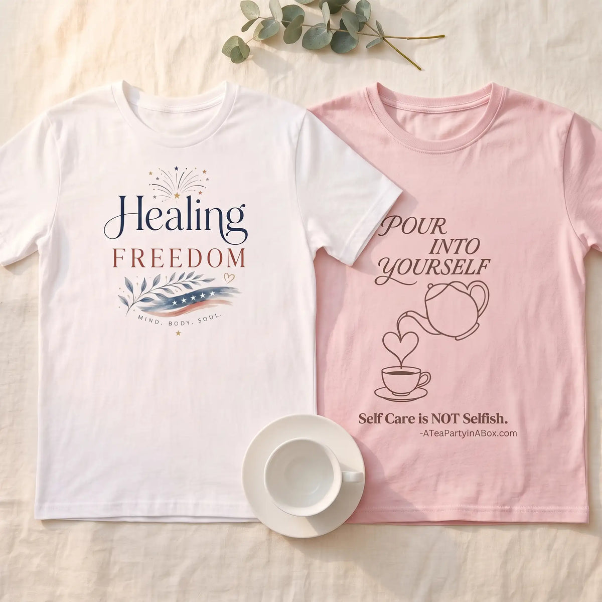 Healing Is Freedom and Pour Into Yourself shirts laid flat side by side with a teacup
