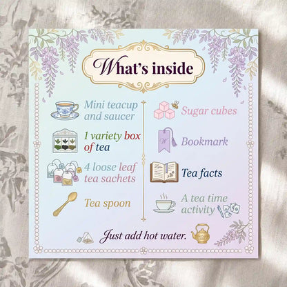 What's inside A Mini Tea Party In A Box: mini teacup and saucer, 4 tea sachets, spoon, sugar cubes, bookmark, activity