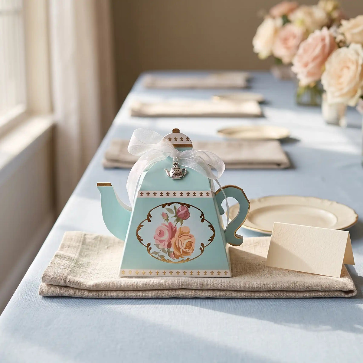 Mini Teapot Sampler gift box as a favor on a napkin at a bridal shower table place setting