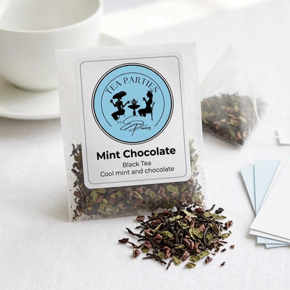 Mint Chocolate loose leaf tea sachet with the Tea Parties by Erica Powers label, black tea, dark twisted black tea leaves mixed with crushed dried green mint leaves and small dark brown cocoa nib pieces