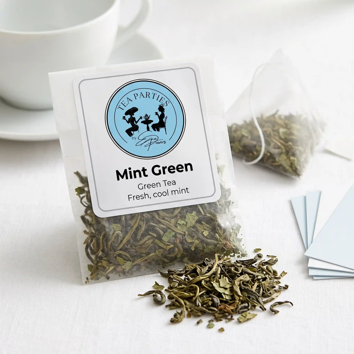 Mint Green loose leaf tea sachet with the Tea Parties by Erica Powers label, green tea, rolled and twisted green tea leaves
