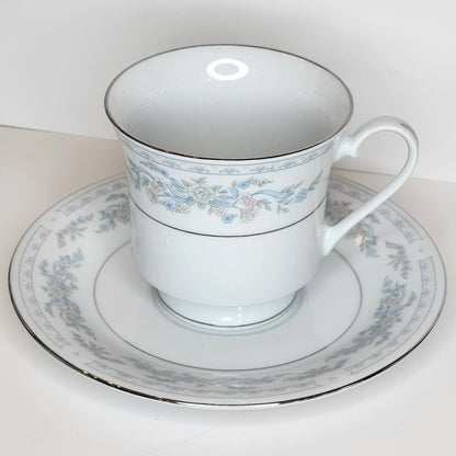 Ribbon Garland teacup and saucer with pale blue ribbons woven through pastel flower garlands, silver-tone rim