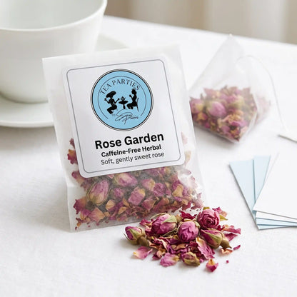 Rose Garden loose leaf tea sachet with the Tea Parties by Erica Powers label, caffeine-free herbal, whole dried pink rose buds and loose pink rose petals