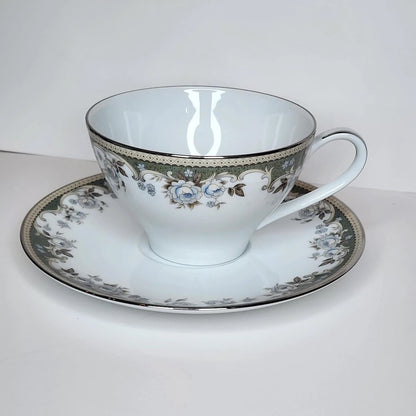 Sage Scroll teacup and saucer with a sage green border, cream scrollwork, pale blue roses and a silver-tone rim