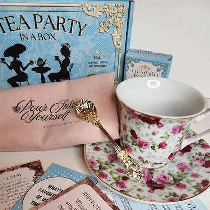 Simple Pleasures box with a rose teacup, gold-tone teaspoon, Pour Into Yourself pouch, a tea box, and tea cards
